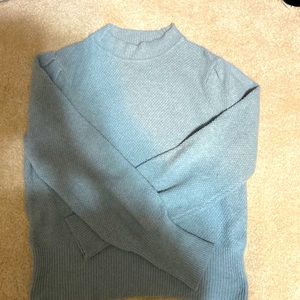 This is a blue Pink Republic sweater.